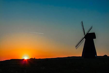 silhouette windmill while sunset thumbnail