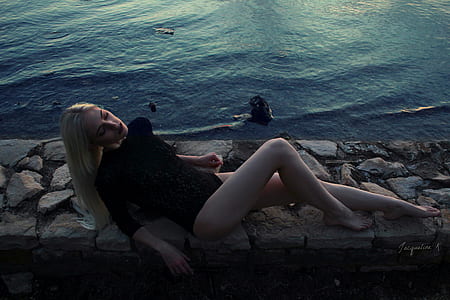 woman in black monokini at seaside thumbnail