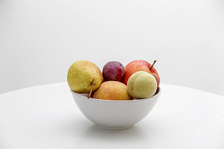 Pear, apple and grape in ceramic bowl thumbnail