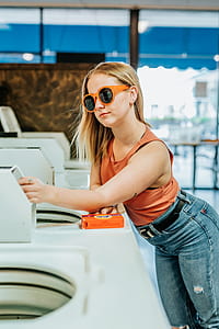 woman holding white machine thumbnail