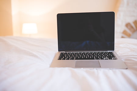 MacBook Pro on white mattress thumbnail