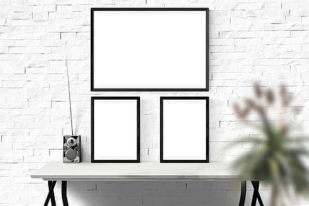black photo frames on white wooden console table thumbnail