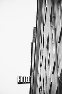 grayscale photo of building with hotel signae thumbnail