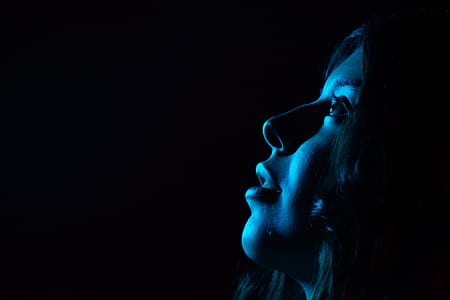 Woman Wearing Hood Facing Upward thumbnail