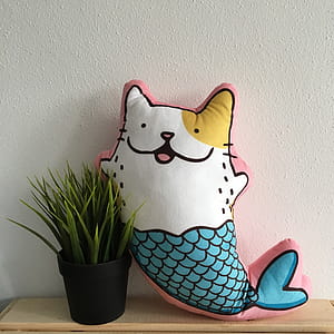 Mermaid Cat Pillow Beside Plant thumbnail
