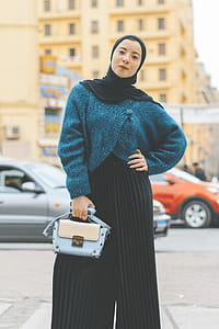 Woman Wears Blue and Black Sweater With Pants thumbnail