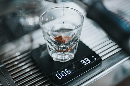clear shot glass on black digital device thumbnail