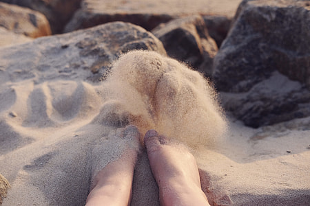 person sitting on gray sand thumbnail