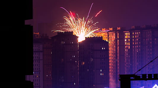 Fireworks Display Near High Rise Buildings during Nighttime thumbnail