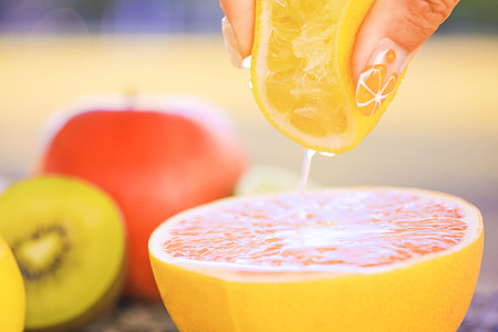 person holding a lemon squeezing thumbnail