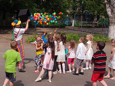 children looking at assorted-color balls thumbnail