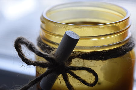 closeup photo of brown tinted glass jar candle holder thumbnail