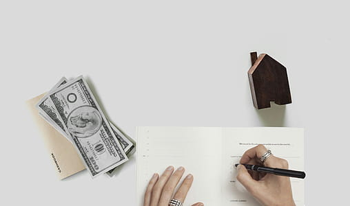 Photo of financial planning - person budgeting for home purchase. thumbnail