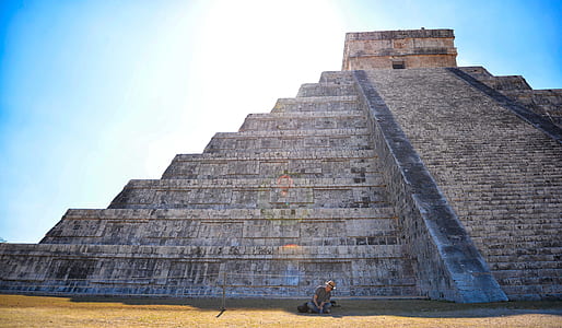 person sitting on edge of Mayan ruins thumbnail