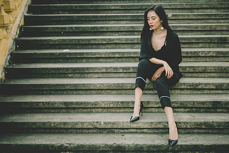 woman wearing black dress sitting on the stairs thumbnail