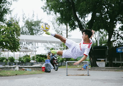 Time Lapse Photography of Soccer Player Jumping Kicking Ball thumbnail