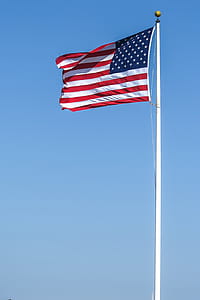 Stars and stripes at full staff, waving in the wind thumbnail