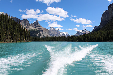 landscape shot of mountain near trees and body of water during daytime thumbnail