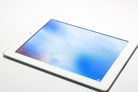white iPad displaying lock screen on white background thumbnail