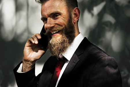 person holding black smartphone thumbnail