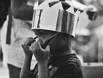 boy wearing crown and black frame sunglasses thumbnail