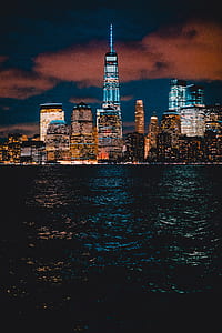 high rise buildings near body of water thumbnail