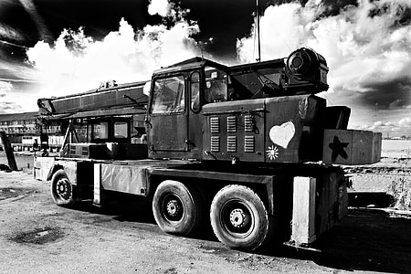 Wide angle black and white shot of an old crane, this image was captured in Faversham, Kent, England thumbnail