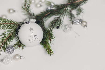 close-up photography of white Christmas bauble and white pearl decorations thumbnail