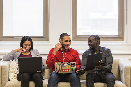 Laughing Friends On Couch Photo thumbnail