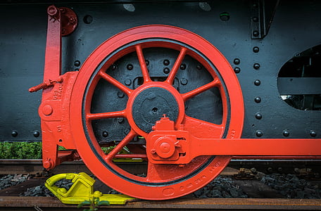 red and black train wheel closeup photography thumbnail