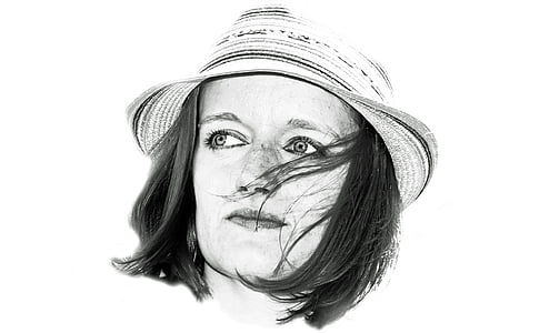 grayscale photography of woman wearing hat thumbnail