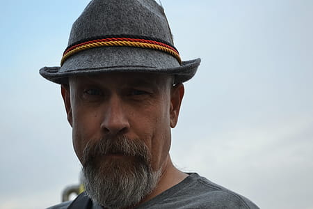 Man Wearing Hat Taking Selfie thumbnail