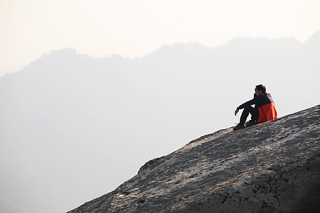 man sitting on mountain thumbnail