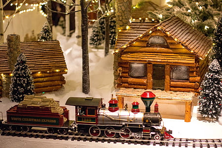 train toy on rail beside house miniature thumbnail