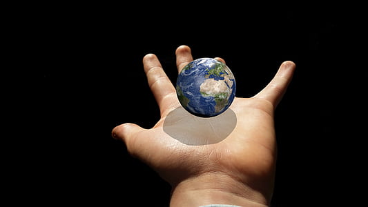globe in human hand clip-art thumbnail