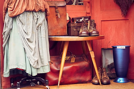 pair of brown leather boots on brown wooden table thumbnail