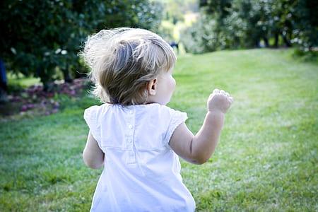 baby in white dress during daytime thumbnail