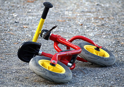 toddler's red and yellow balance bicycle thumbnail