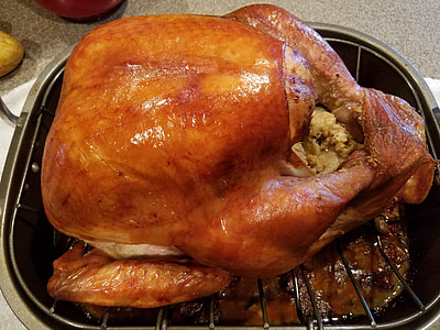 roasted chicken on pot close-up photo thumbnail