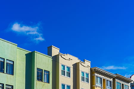 yellow and green painted buildings thumbnail