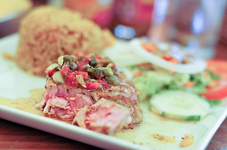 selective focus of meat dish on white plate thumbnail