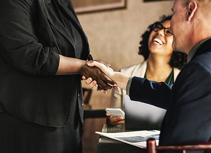 man and woman shaking their hands together thumbnail