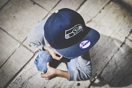 boy wearing black Seattle Seahawks fitted cap thumbnail