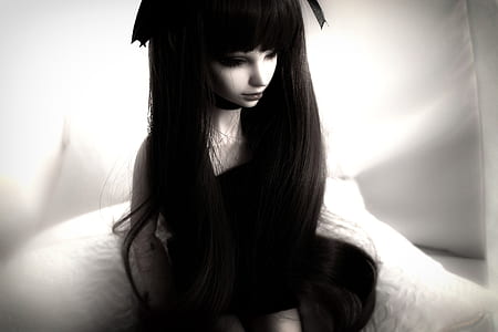 doll wearing black dress thumbnail