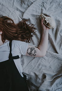 woman lying on bed thumbnail