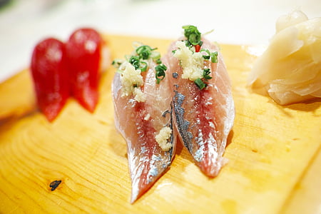 two slices of fish meats with vegetables on brown wooden surface thumbnail