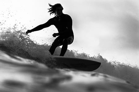 person surfboarding during daytime thumbnail