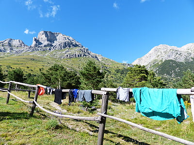 clothes hanging on fence thumbnail