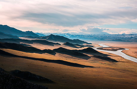 areal photography of rocky mountain near river thumbnail