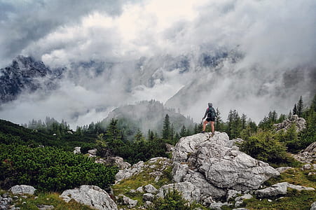 person standing on formation rock thumbnail